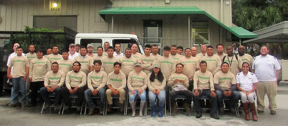 The Greenscapes team photographed together outside the company yard on North Osprey Avenue, Sarasota